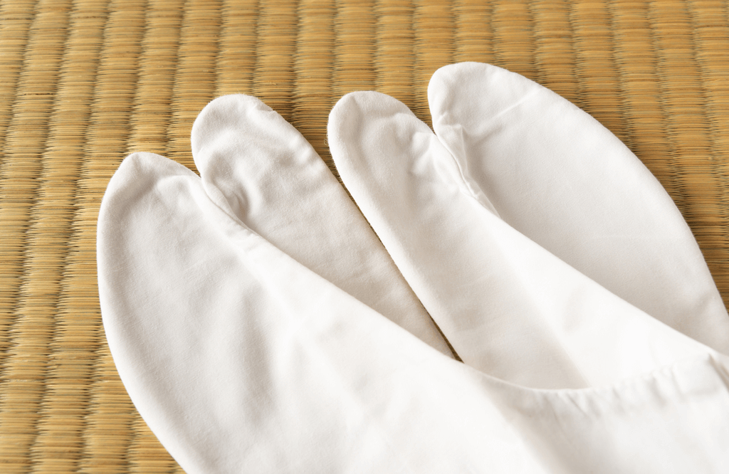 A pair of white tabi socks.