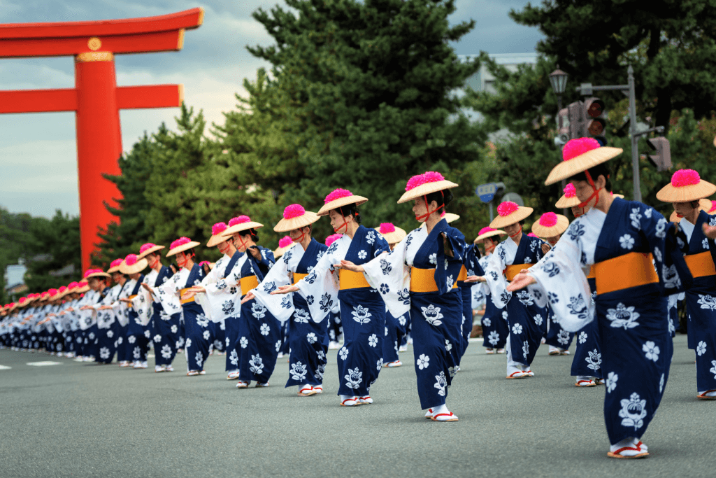 A bunch female dancers in blue kimono at the Jidai Matsuri.