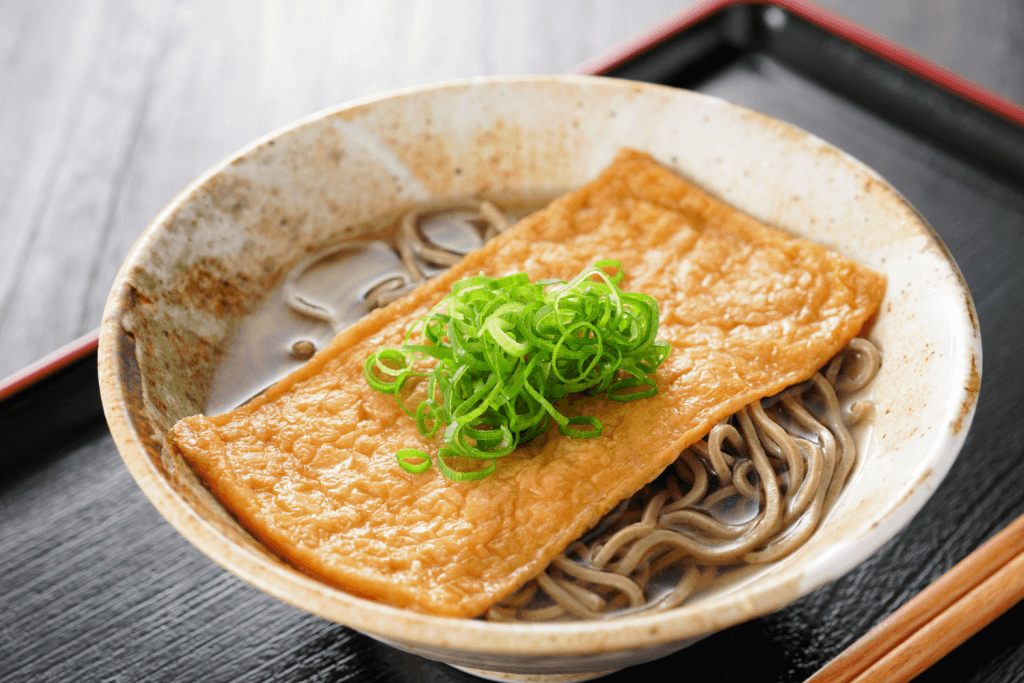 A bowl of kitsune soba with tofu,