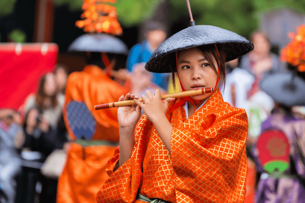 A woman playing the flute at the Jidai Matsuri, an October festival in Japan.