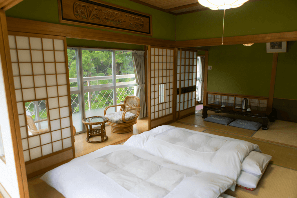 A bedroom with two futon mattresses in a ryokan bedroom.