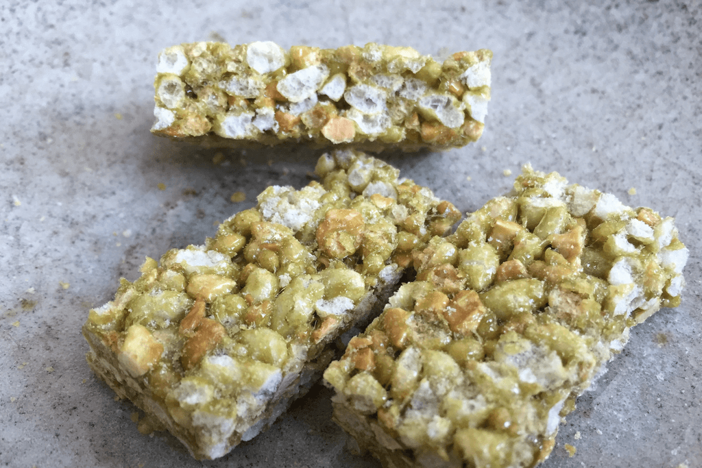 A bunch of green tea puffed rice squares.