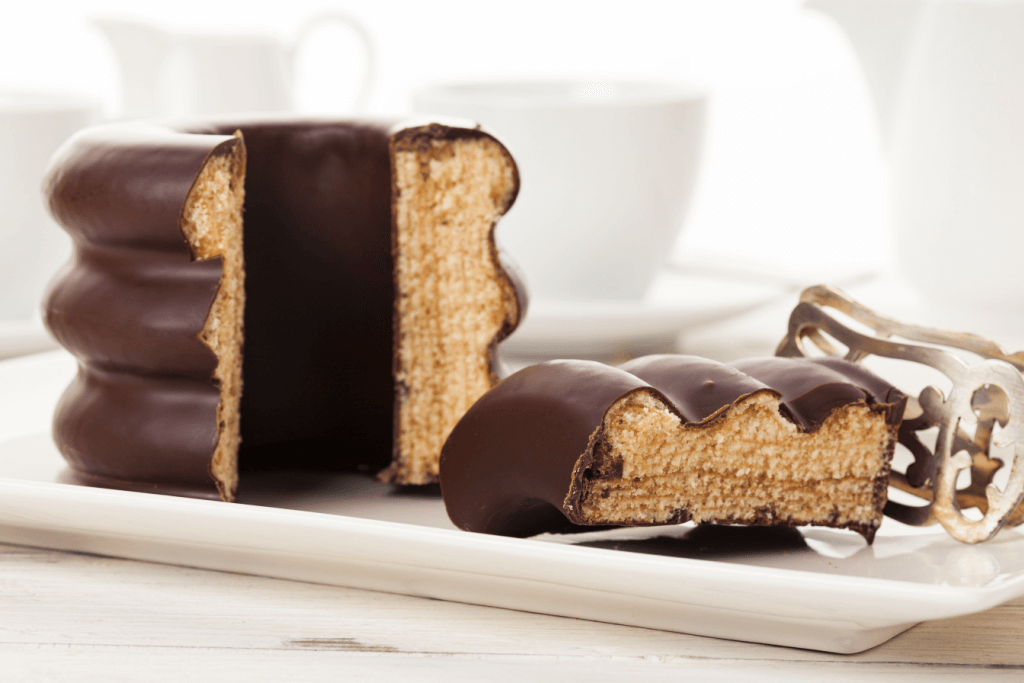 A plate of chocolate covered baumkuchen.