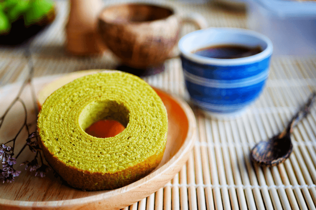 Green tea baumkuchen on a plate.