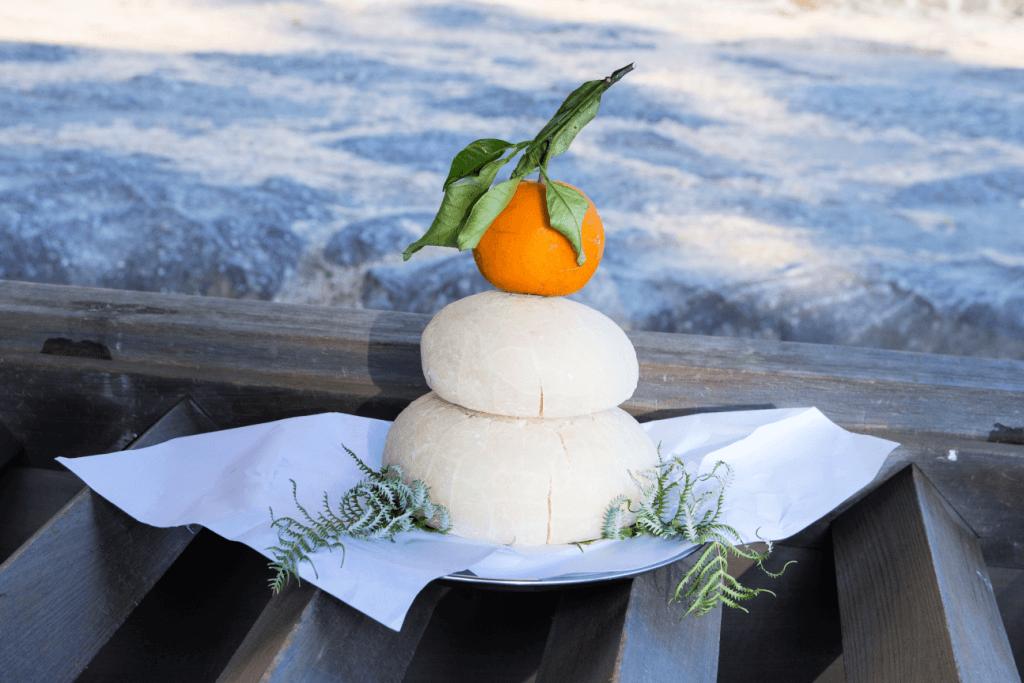 Kagami mochi with a bitter orange on top.