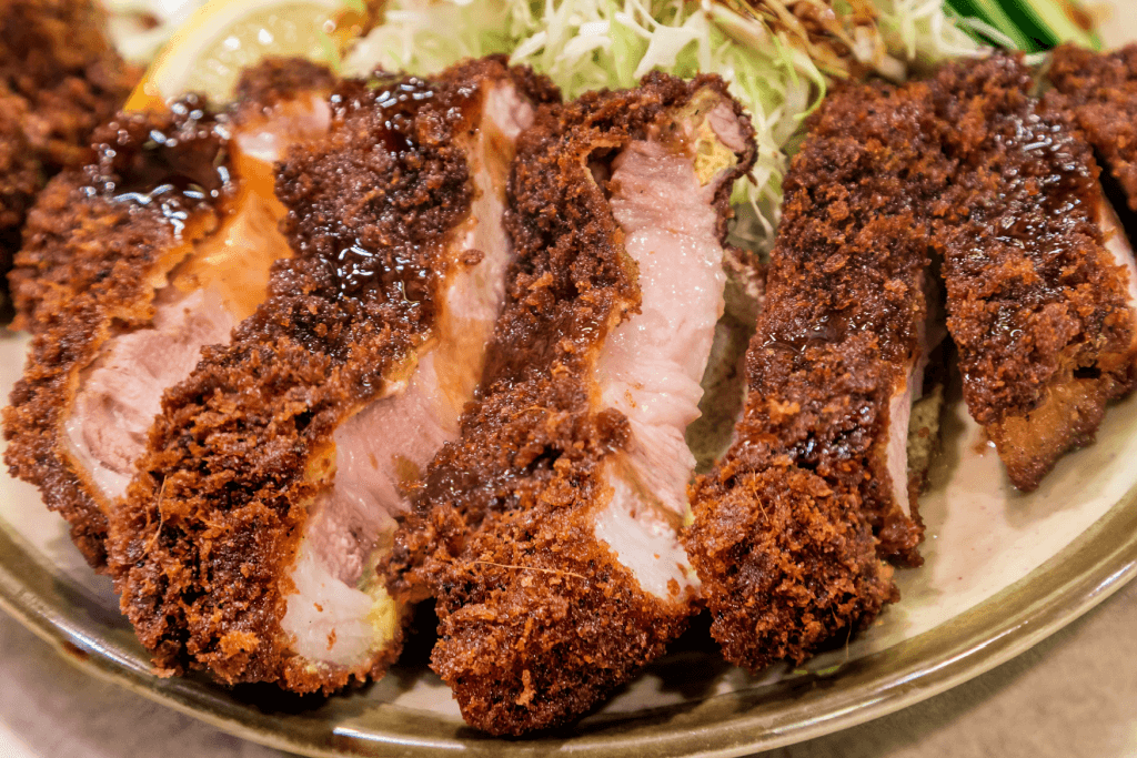 A plate of deep-fried Kagoshima black pork cutlet.