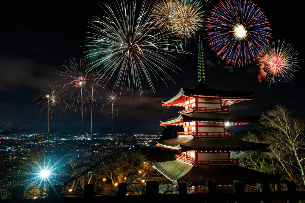 Chureito Pagoda near Mt Fuji, surrounded by fireworks, a New Year's tradition.