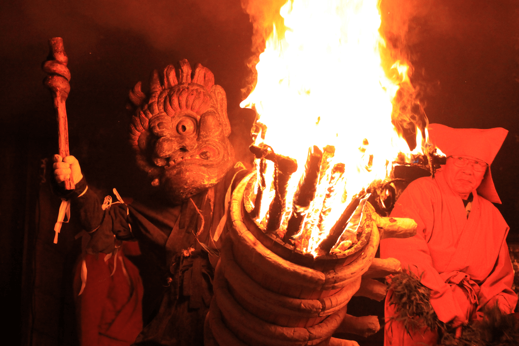 A "demon" dancing with fire at the Oni Hashiri festival.