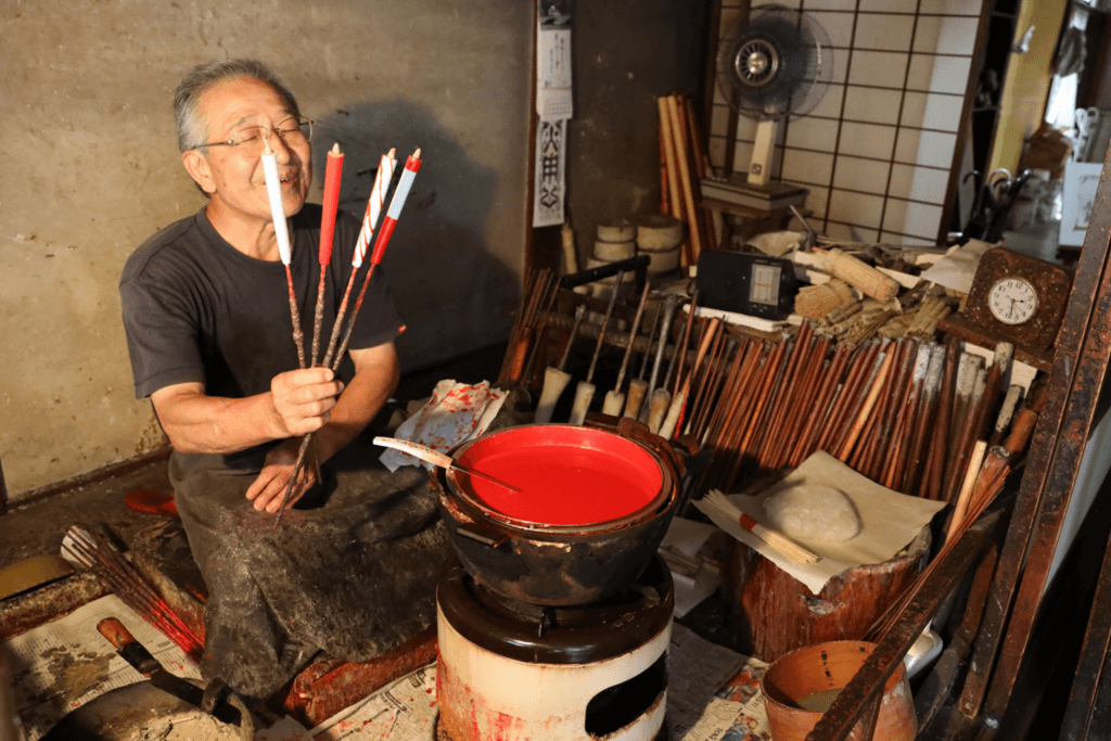 A man making candles at Mishima Candle Shop.