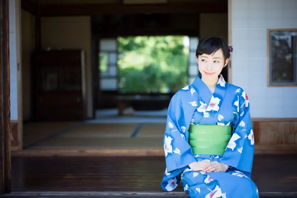A woman in a blue kimono.