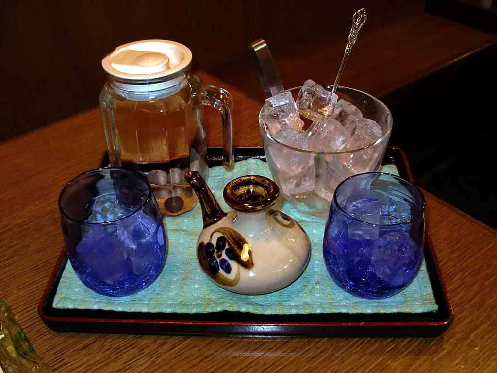A tray of awamori with glasses and a pot.