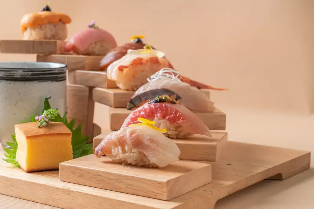 An arrangement of fancy nigiri sushi for an omakase dining set. 