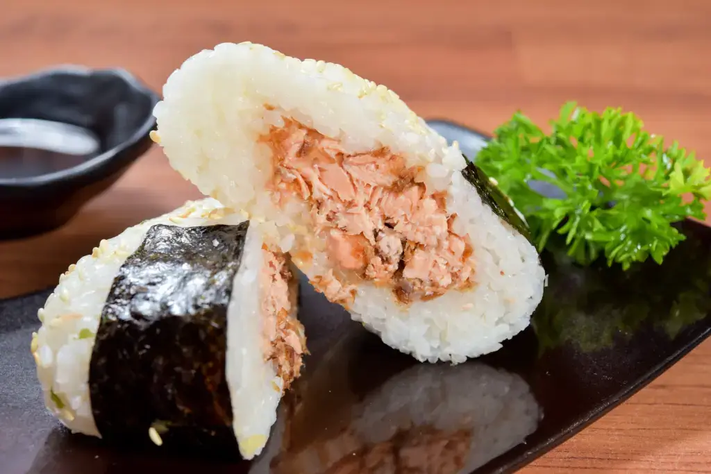 A rice ball with salmon inside.