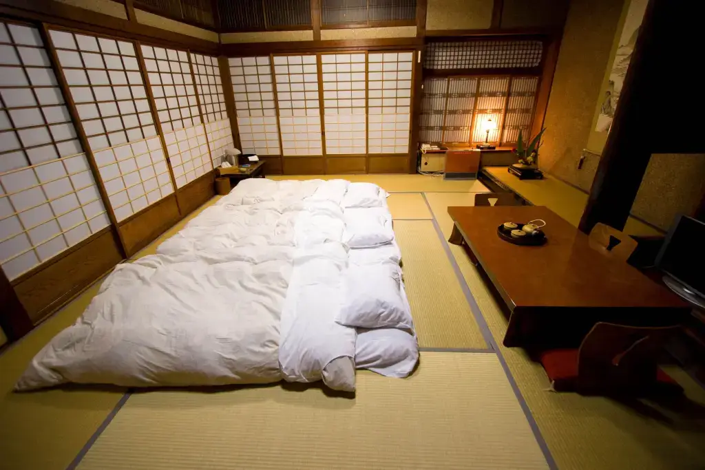 The inside of a ryokan bedroom with futon.