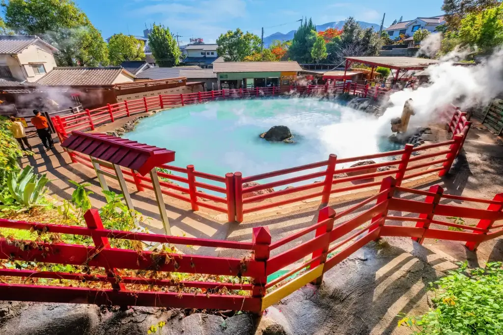 A hot spring with a red fence in Beppu.