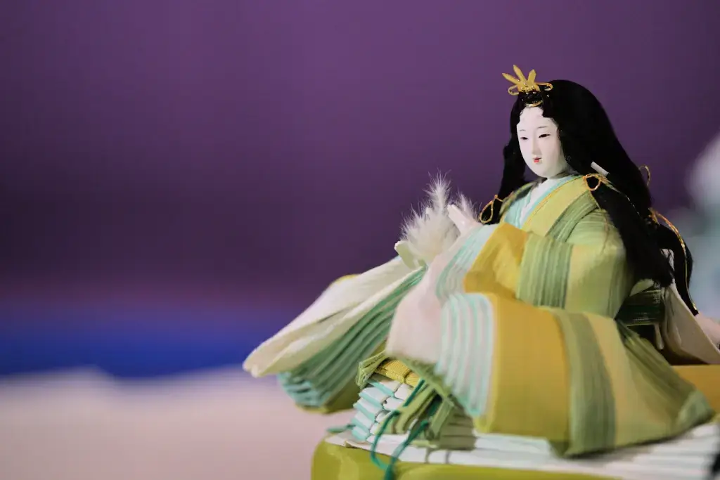 A green Hina Doll representing the empress regnant.