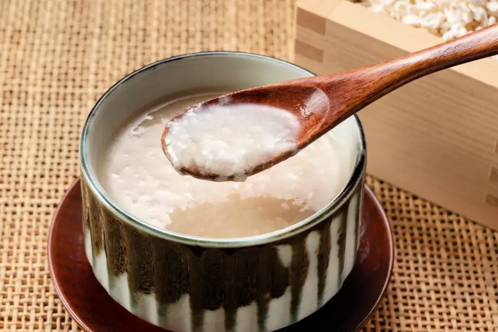 A cup of amazake, sweet fermented rice drink.