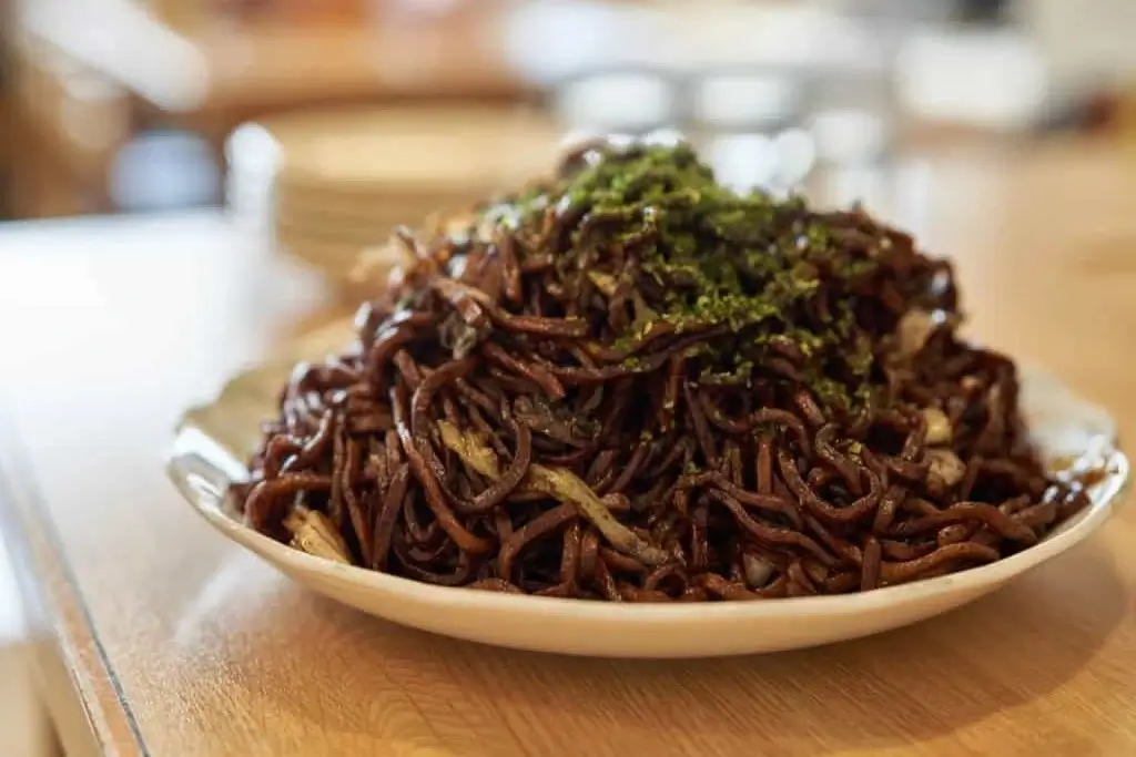 A plate of Oota yakisoba. The sauce is very dark.