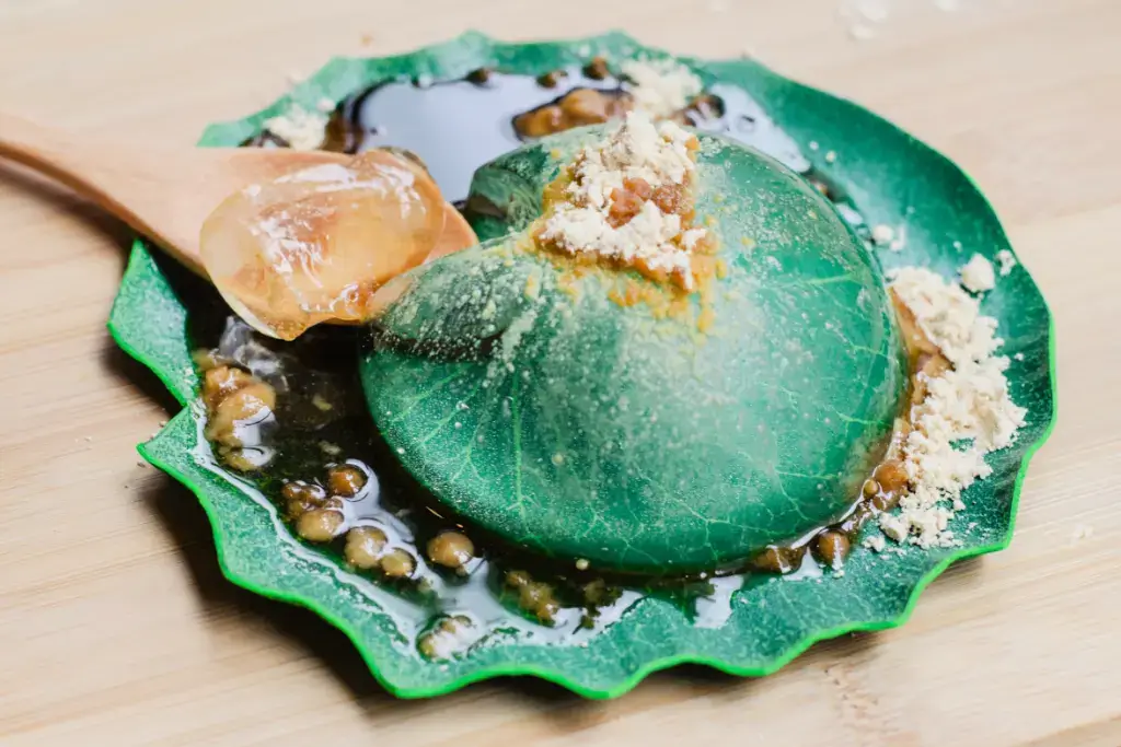 A raindrop cake on top of a leaf.