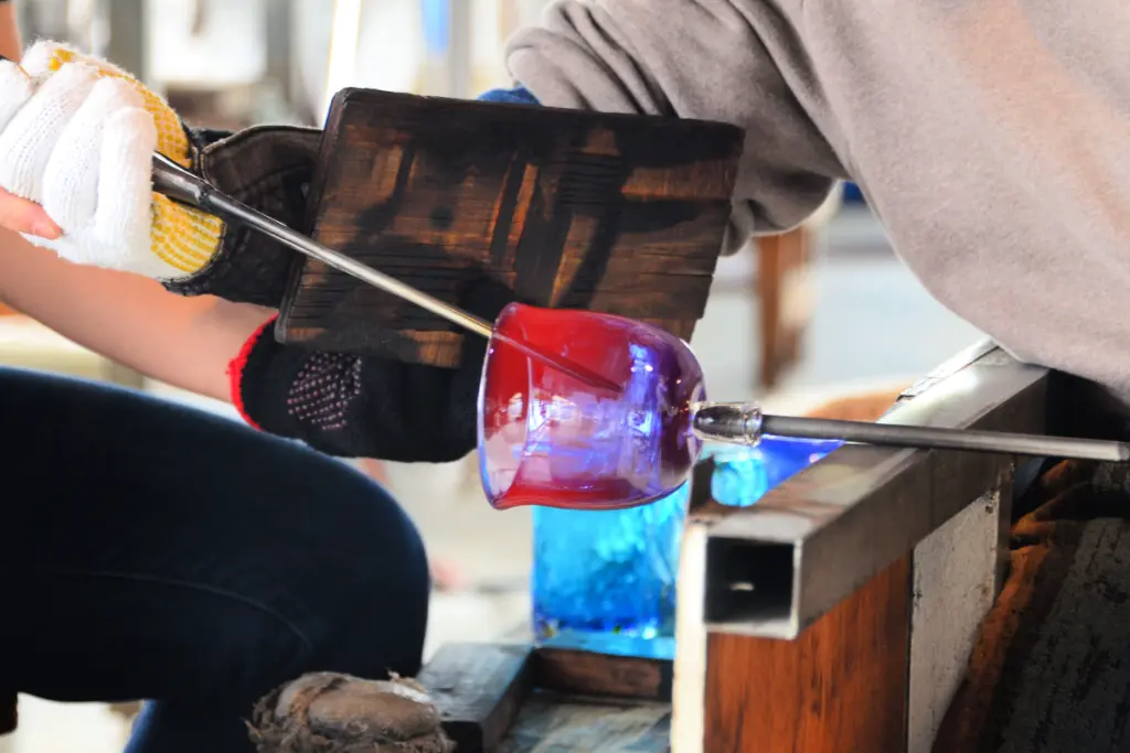 People blowing glass at the Ryukyu Glass Village.