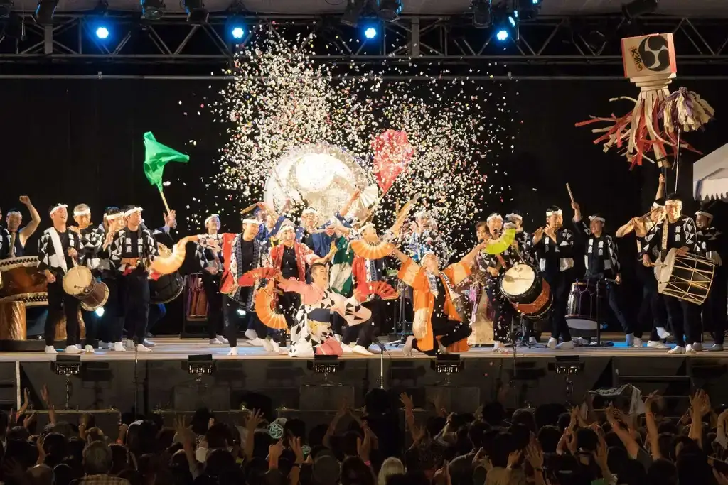 A performance with confetti at the Sado Earth Celebration.