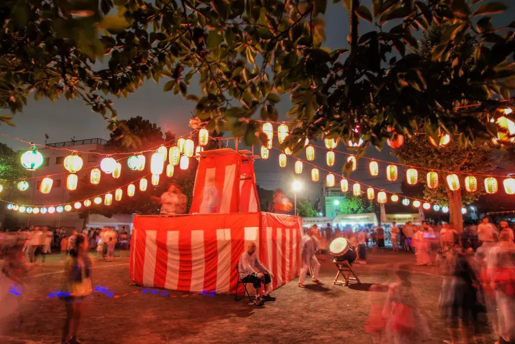 A Bon Odori event in Tokyo at night.