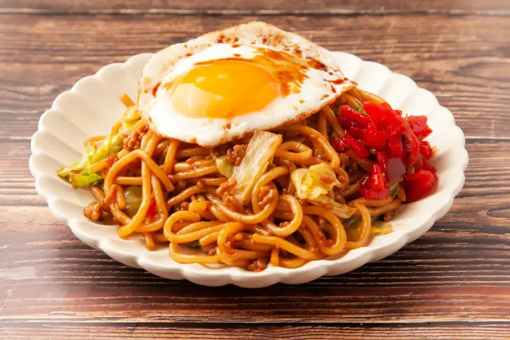 Yakisoba with an egg on top.