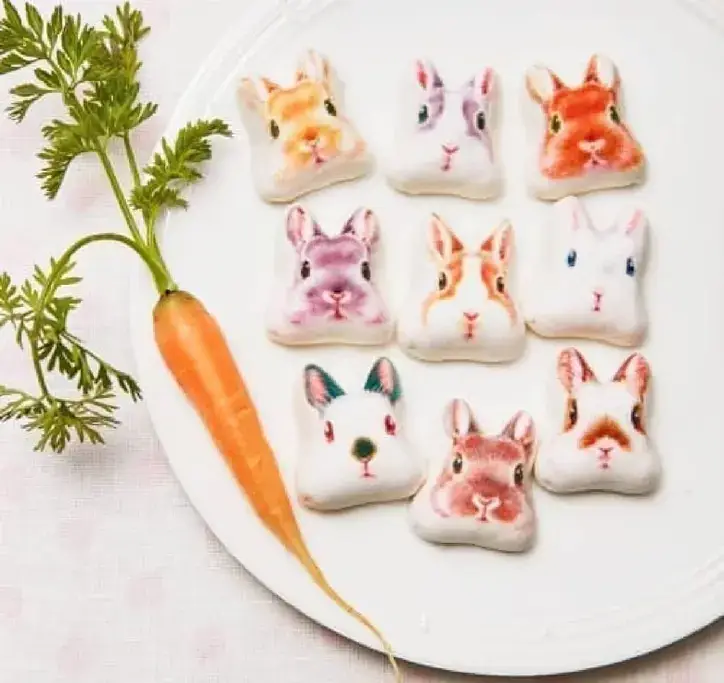 A plate of hozui treats shaped like rabbits.