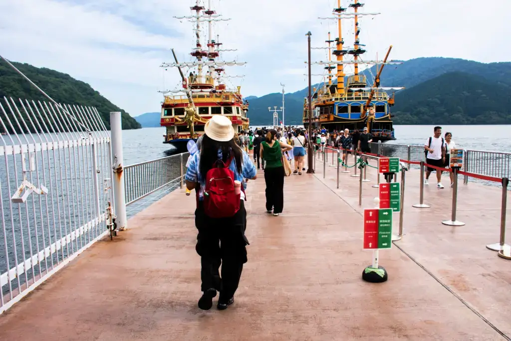 A person walking on a pier in Hakone, Kanagawa.