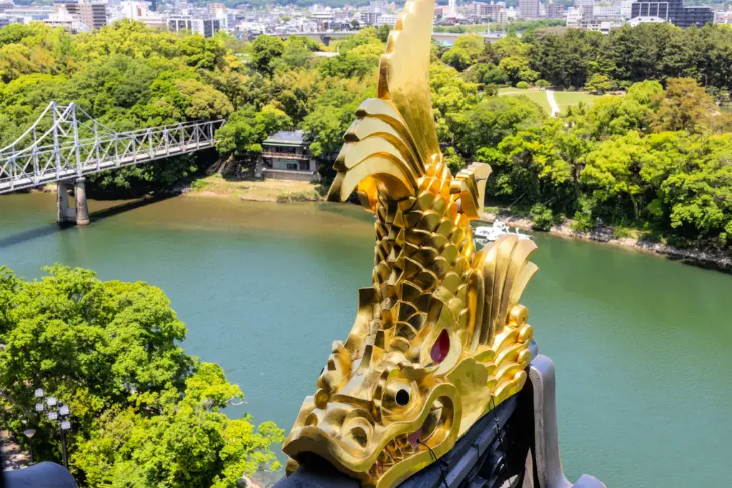 A golden koi roof fixture in Okayama City.