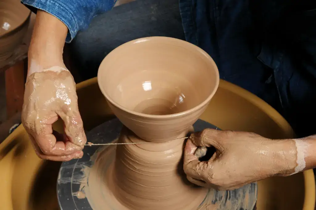 A person making a Japanese pottery bowl.