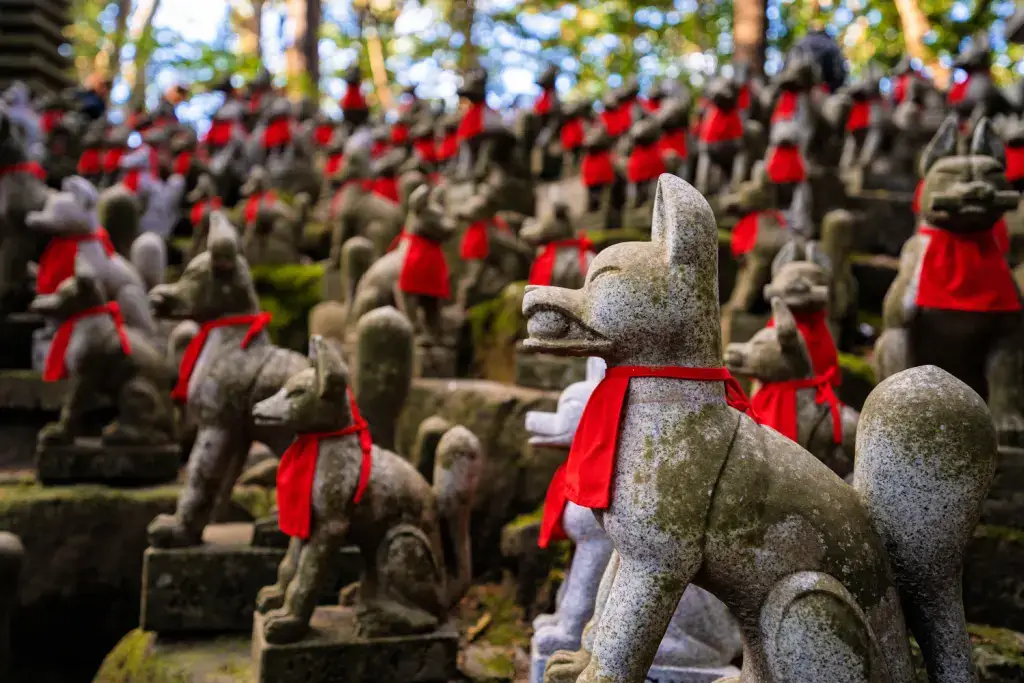 A bunch of stone fox statues at Toyokawa.