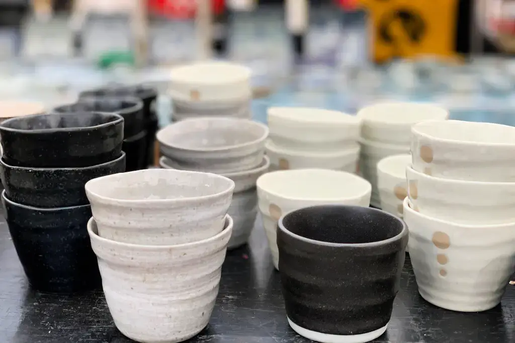 An assortment of yunomi teacups at a store.