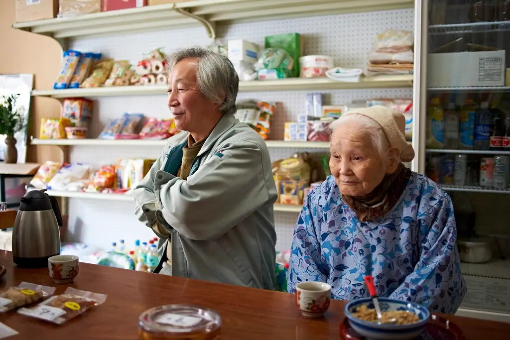 Two members of the Yokoi family in their shop.