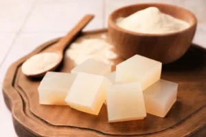 A bowl of agar agar powder and agar cubes.