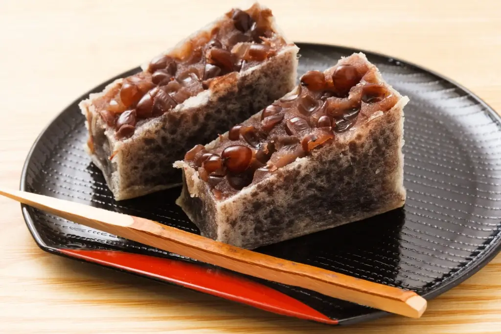 Two slices of kintsuba on a plate. It's a rougher type of youkan.