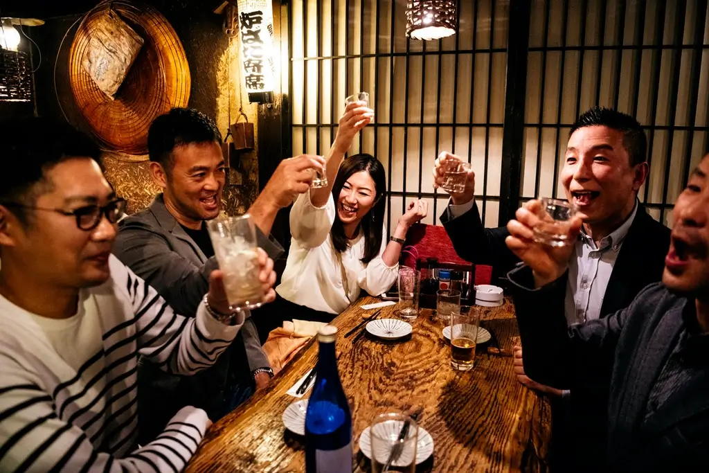 People enjoying a bonenkai at a restaurant.