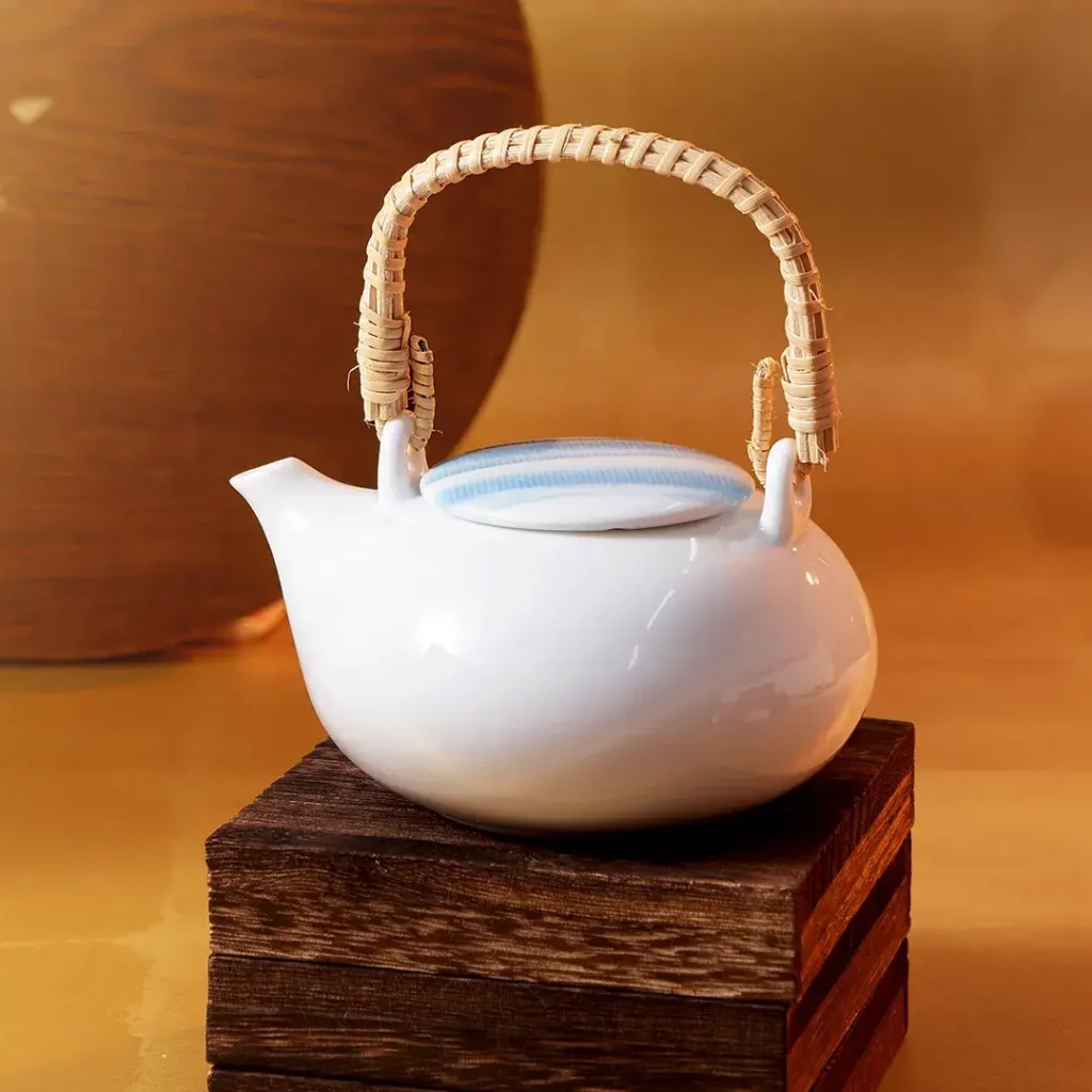 A white, artisan Japanese teapot.