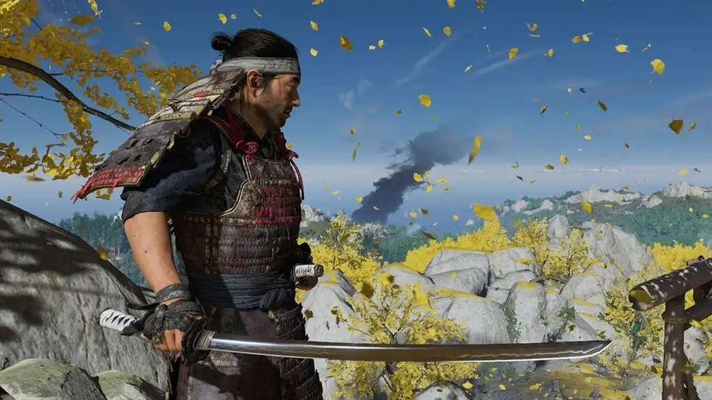 A gameplay screenshot from "Ghost of Tsushima". A person is holding a sword while standing in a field.