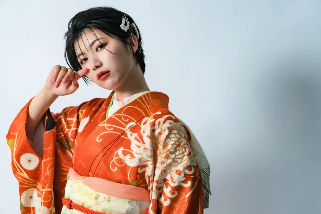 A woman wearing a fashionable kimono.