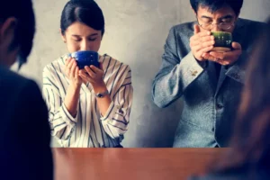 A couple enjoying tea at a Japanese tea ceremony.