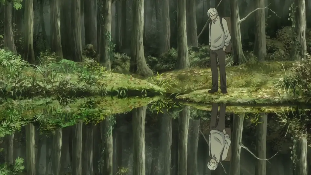 The main character of "Mushishi" standing near a lake.