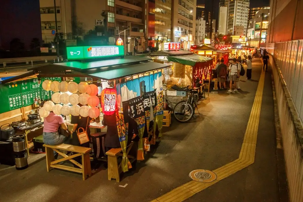 A bunch of street stalls on a street in Fukuoka.