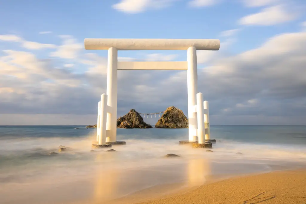 A white torii gate at Sakurai Futamigaura.