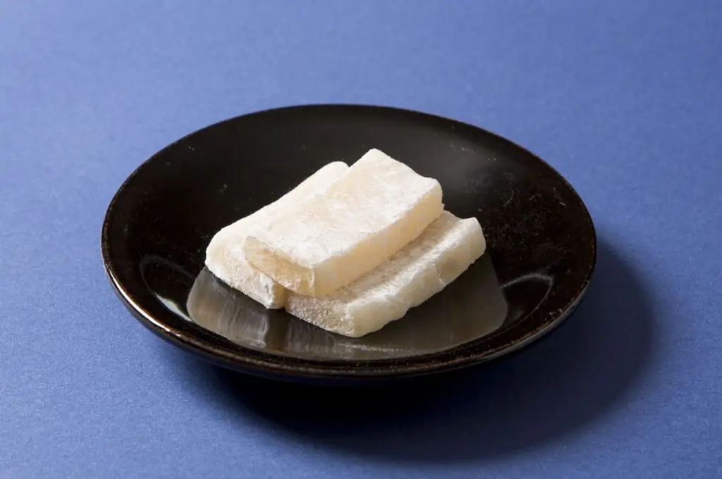 A plate of Chosen Ame. They're long white rectangles.