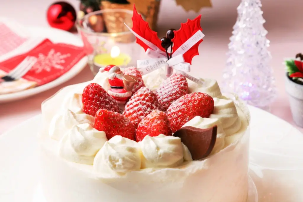 A Japanese Christmas cake with strawberries on top. 