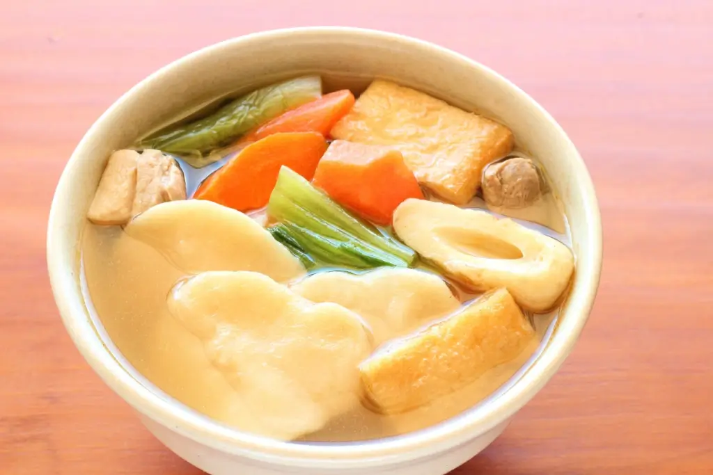 A bowl of dagojiru, featuring thick noodles and vegetables.