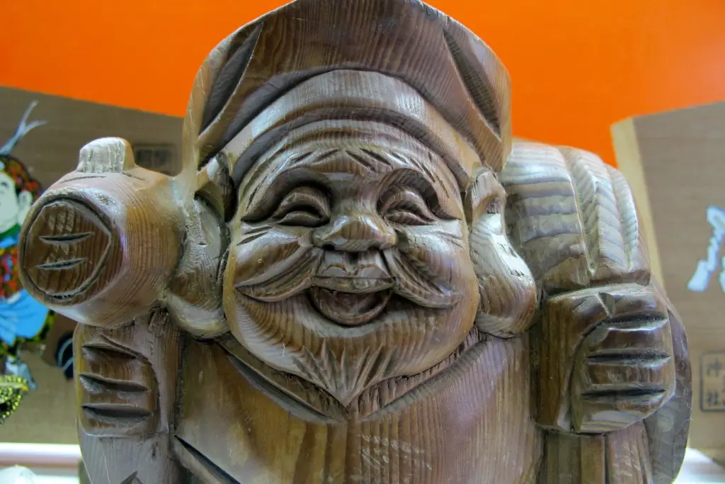 A statue of Daikokuten. He has large ears and a hat.