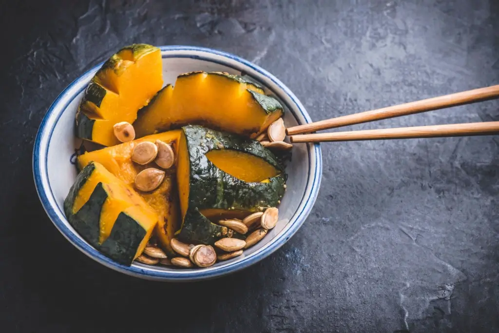 Chopped up kabocha and pumpkin seeds.