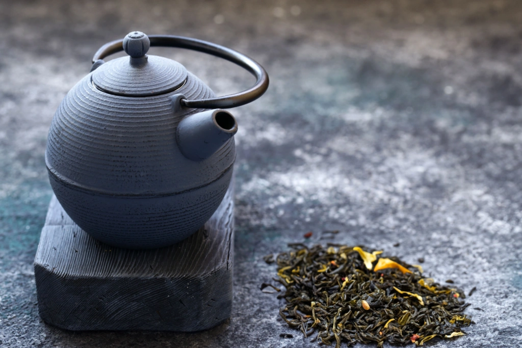 A teapot with green tea.